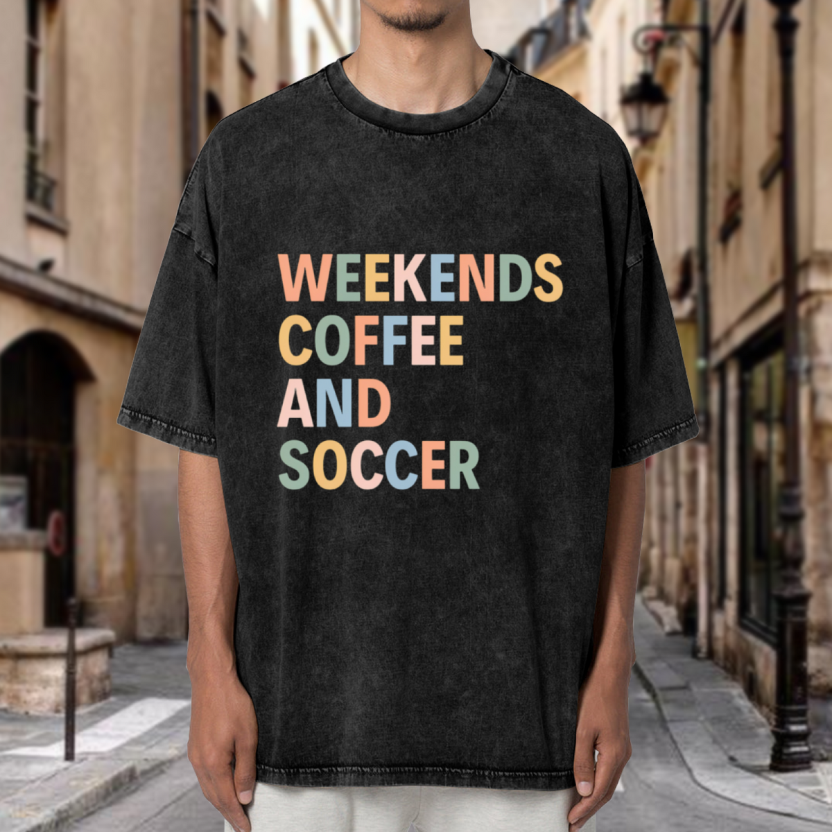 Unisex washed graphic T-shirt with Weekends Coffee And Soccer themed design, product image