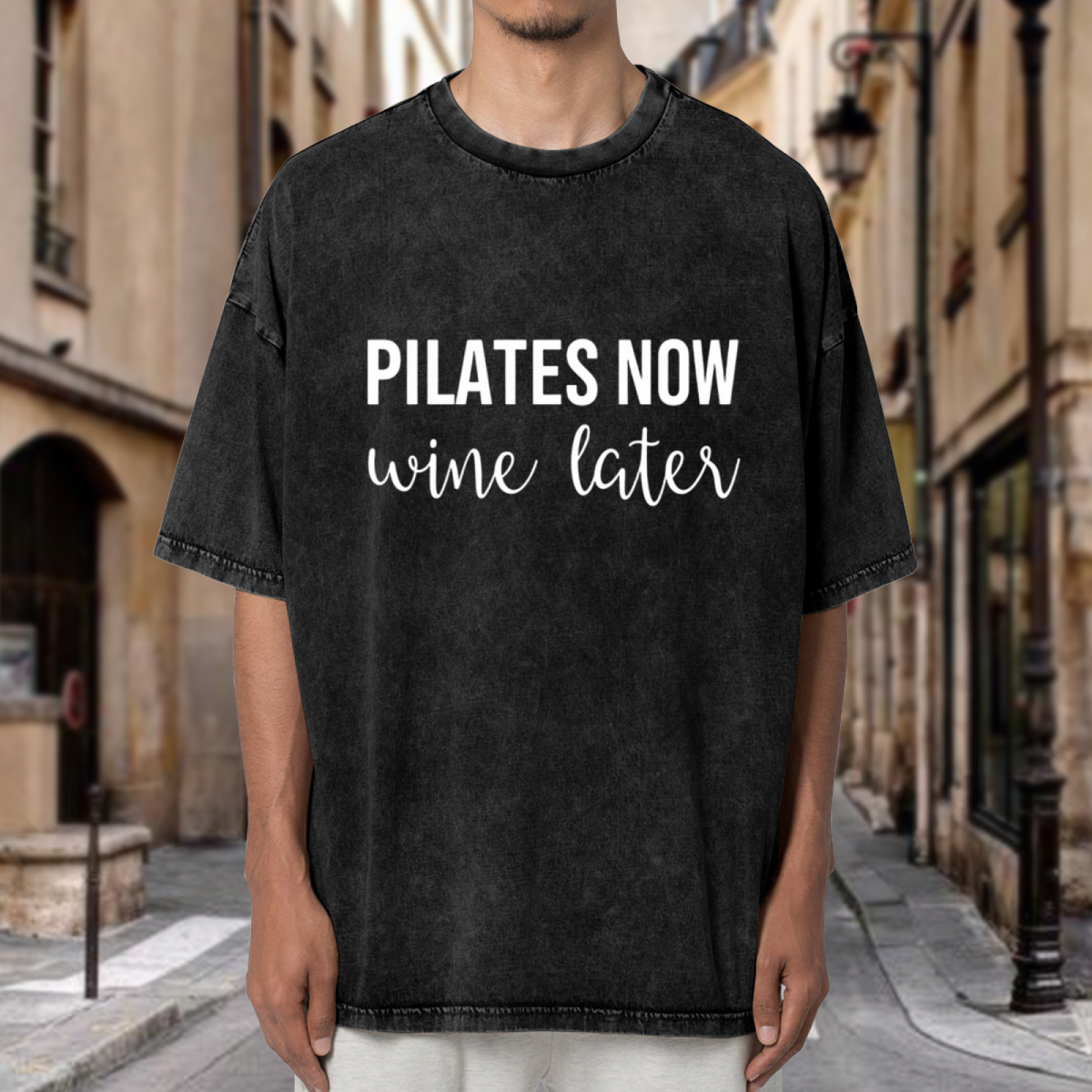 Unisex washed graphic T-shirt with Pilates Now Wine Later themed design, product image