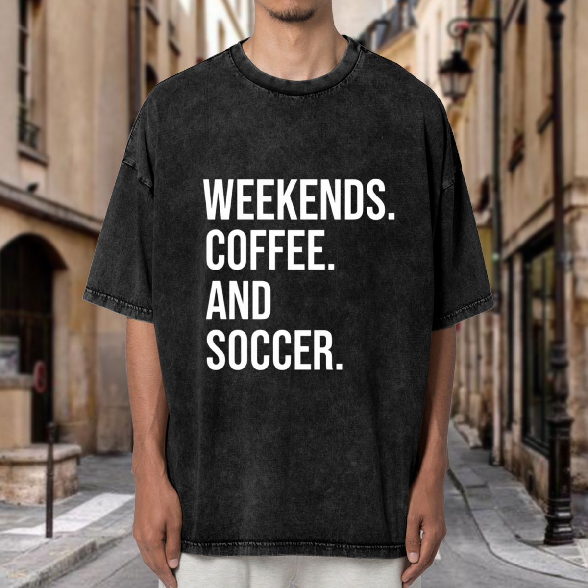 Unisex washed graphic T-shirt with Weekends Coffee And Soccer themed design, product image