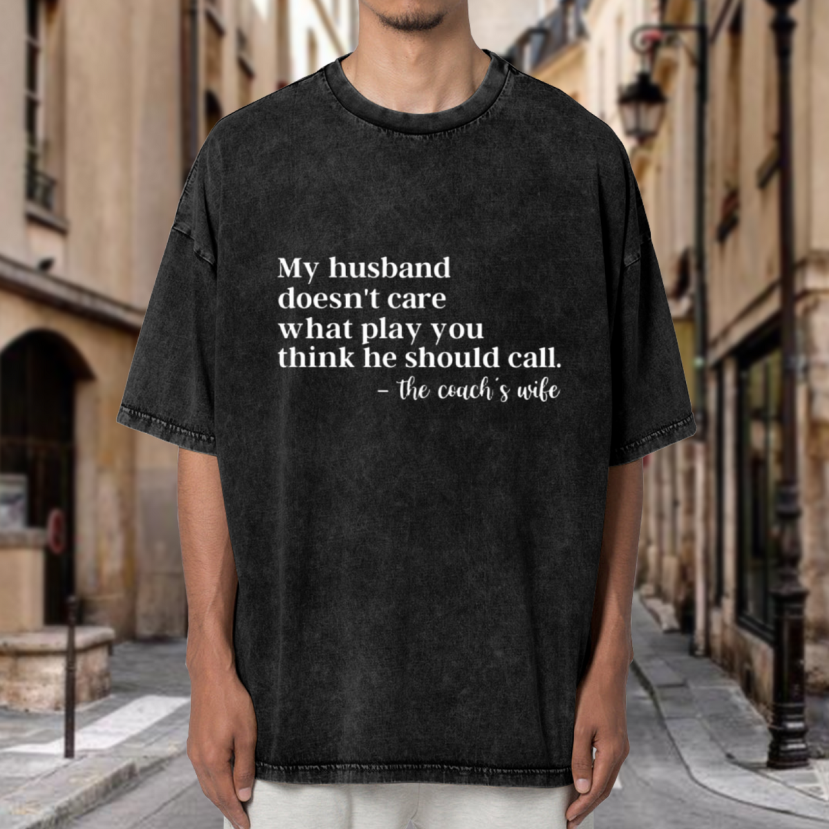 Unisex washed graphic T-shirt with My Husband Doesn't Care What Play You Think He Should Call The Coaches Wife themed design, product image