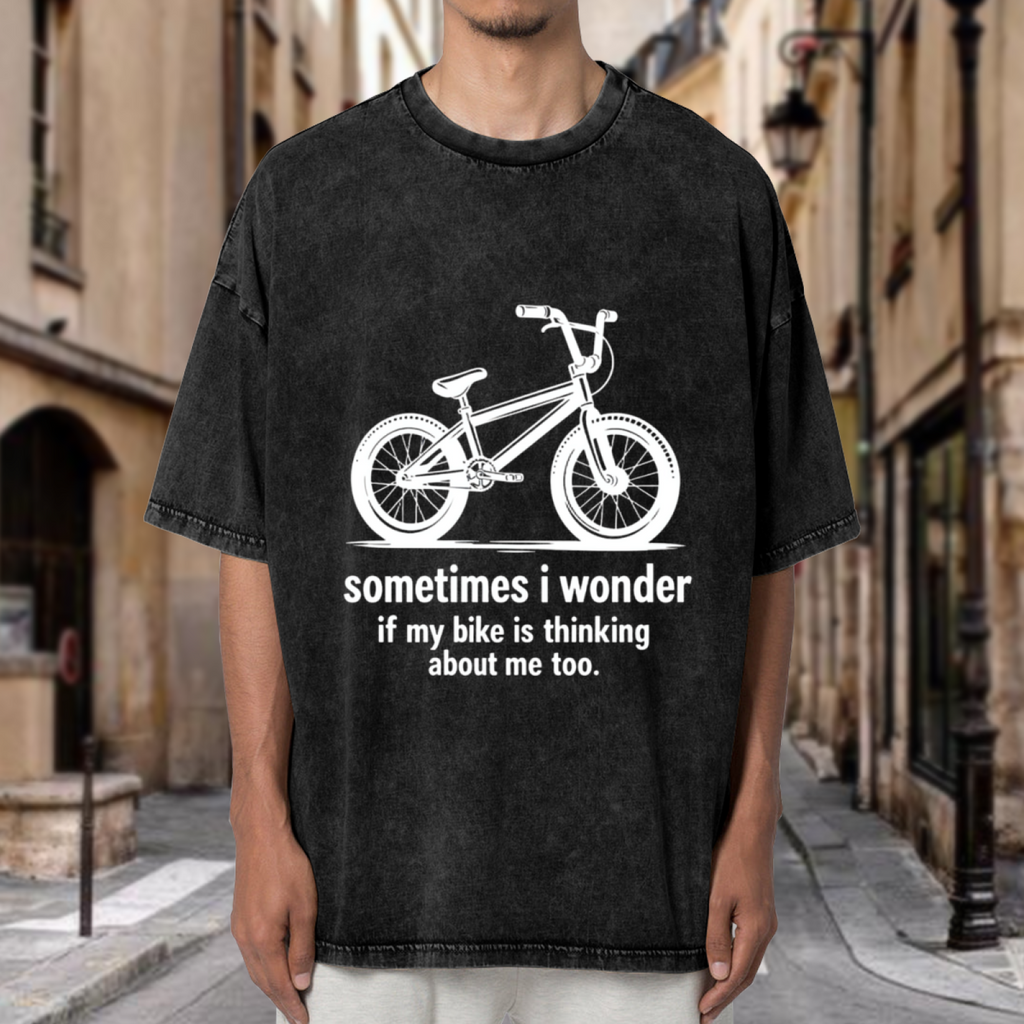Unisex washed graphic T-shirt with Sometimes I Wonder If My Bike Is Thinking About Me Too Bike themed design, product image