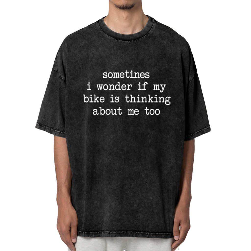 Unisex washed graphic T-shirt with Sometimes I Wonder If My Bike Is Thinking About Me Too Bike themed design, product image