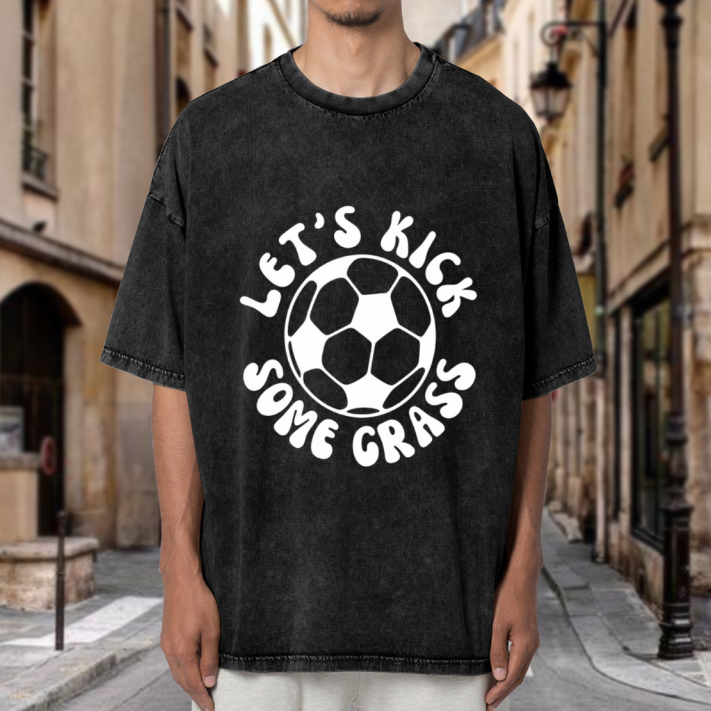 Unisex washed graphic T-shirt with Let's Kick Some Grass themed design, product image