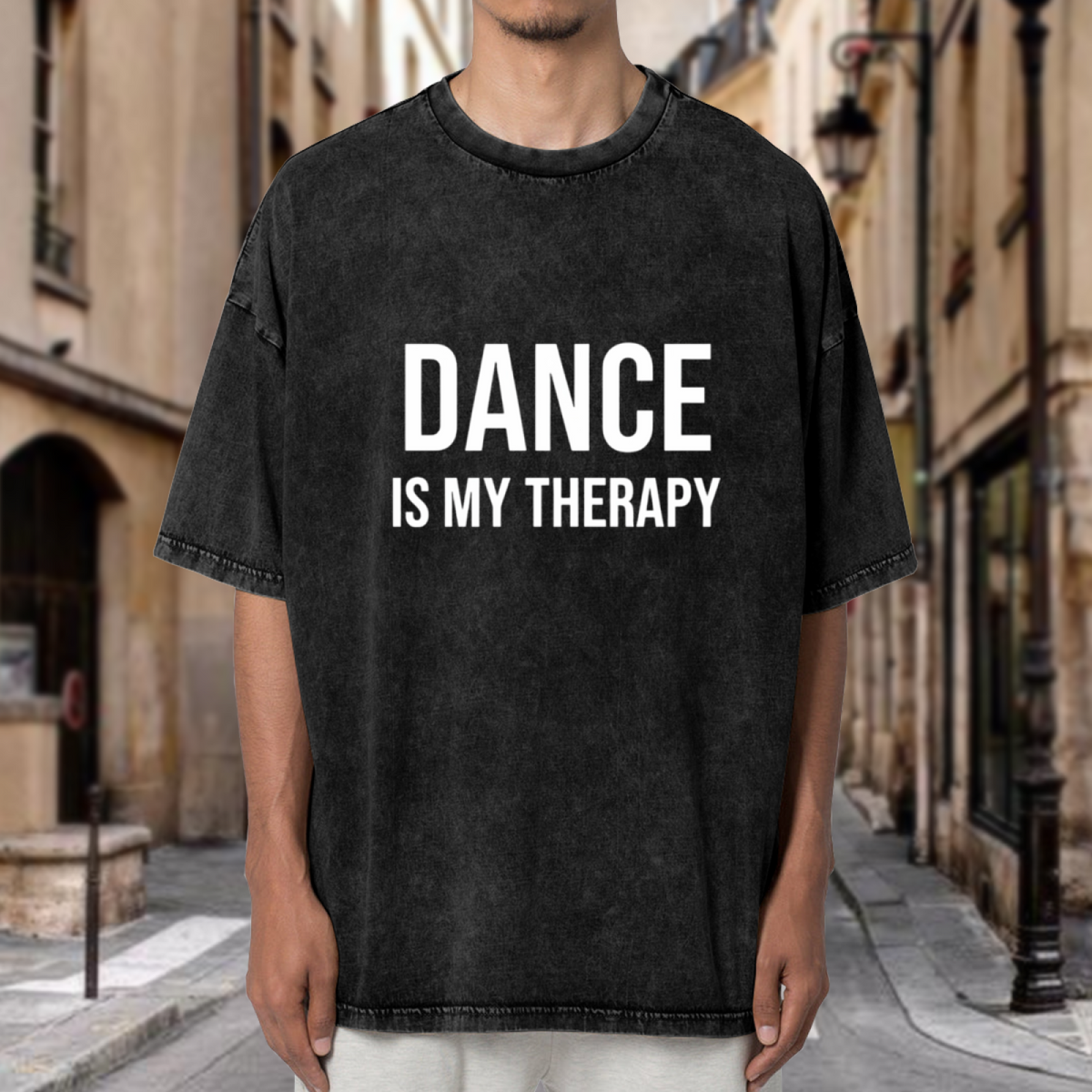 Product image of washed graphic T-shirt featuring 'Dance Is My Therapy' statement design