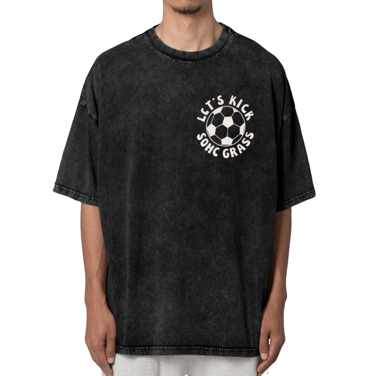 Unisex washed graphic T-shirt with Let's Kick Some Grass themed design, product image