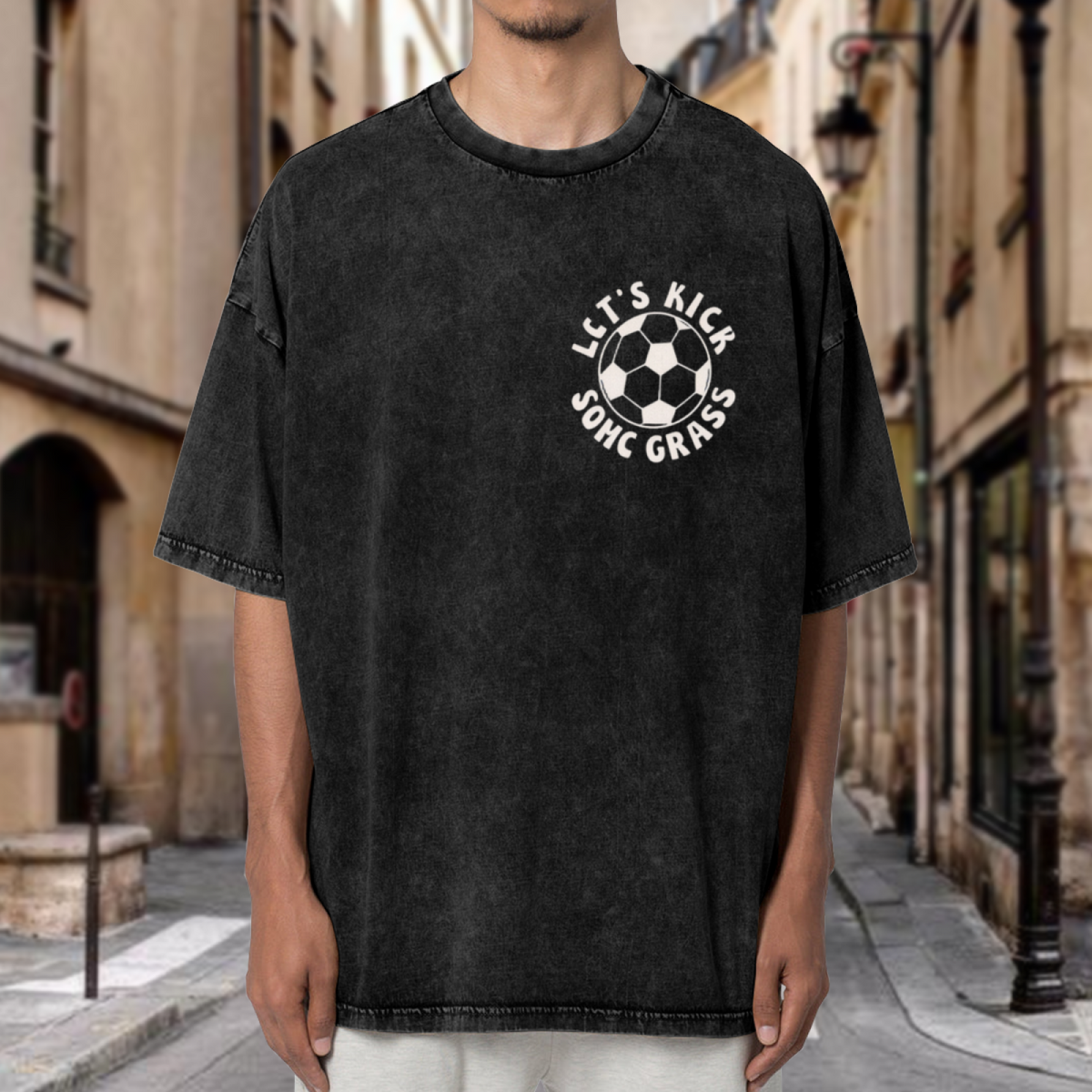 Unisex washed graphic T-shirt with Let's Kick Some Grass themed design, product image